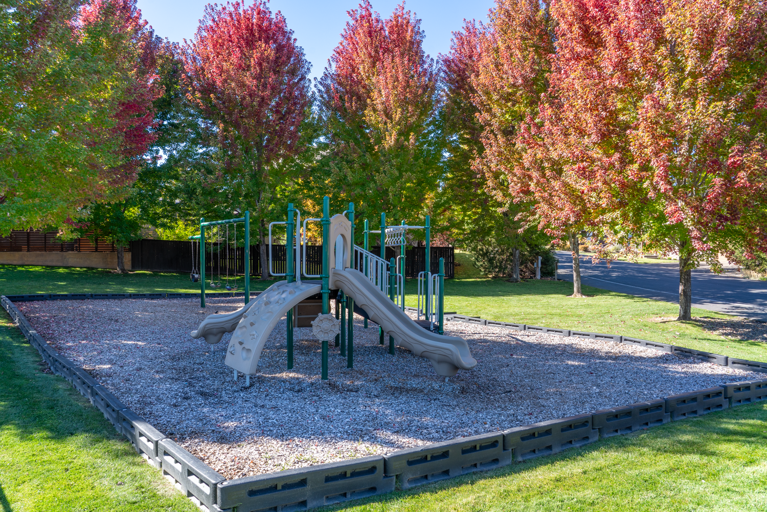 Neighborhood playground and fall landscaping at The Bridges at Shadow Glen in Bend, Oregon